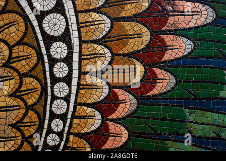 Vintage texture. Detail of beautiful old collapsing abstract ceramic mosaic adorned building. Mosaic decorative background. Abstract pattern, colored ceramic stones. Stock Photo