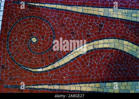 Vintage texture. Detail of beautiful old collapsing abstract ceramic mosaic adorned building. Mosaic decorative background. Abstract pattern, colored ceramic stones. Stock Photo