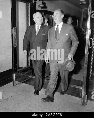 Former President Harry Truman walks out of a Chicago hotel door with presidential candidate Adlai Stevenson in 1956. Stock Photo