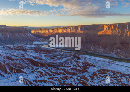 Colorado River and badlands near Moab, Utah, winter snow at sunset Stock Photo