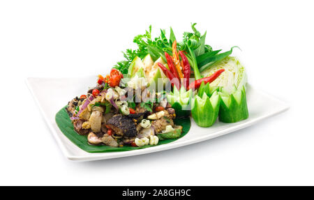 Spicy Raw Offal Beef Salad with ingredient Spicy Herbs Thai Food Popular in Northern Style decorate with carved cucumber and vegetables side view Stock Photo