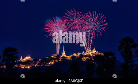 Beautiful colorful fireworks festival over the Phra Nakhon Khiri Historical Park on mountain in night time at Phetchaburi, Thailand Stock Photo