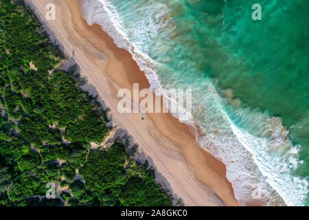 Beach aerial view from drone beach shadow people sunrise Stock Photo