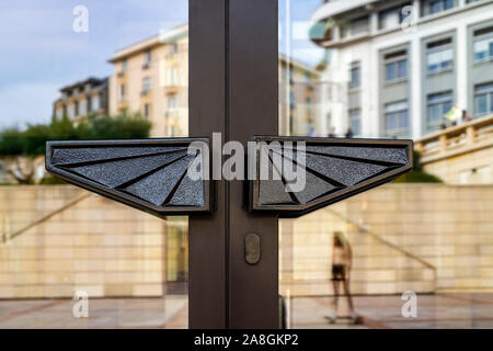 The Art Deco door handles of the Municipal Casino of Biarritz. This building has been erected by the architect Alfred Laulhé in 1929. Stock Photo