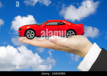 Hand mit Modellauto, Frauenhand, Roter Chevrolet, Camaro, ZL1, USA, Stock Photo