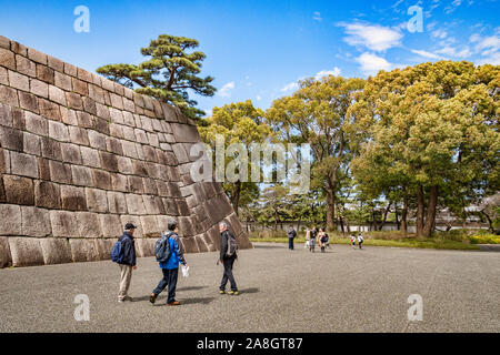 21 March 2019: Tokyo, Japan - Visitors at the former site of the main keep of Edo Castle, now part of the Imperial Palace grounds. Stock Photo