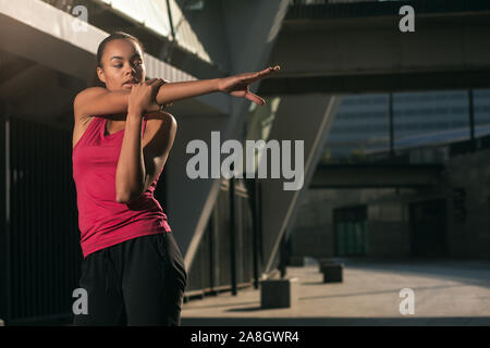 Stretching shoulder muscles before training stock photo Stock Photo