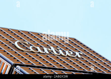 The Boutique Cartier Tokyo Ginza building detail. The Cartier logo near the top of the exterior lattice facade wall. Stock Photo