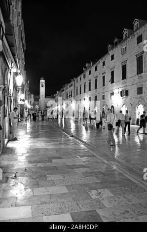 Dubrovnik / Croatia - 10-06-2015 - Black and White Picture of Main Street at Night with Crowd (People) in Old Town (Imperial Fortress) Stock Photo