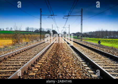 Train rails in country landscape Stock Photo