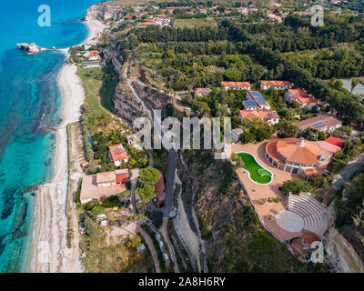 Aerial view of the Calabrian coast, villas and resorts on the cliff. Transparent sea and wild coast. Locality of Riaci near Tropea, Calabria. Italy Stock Photo