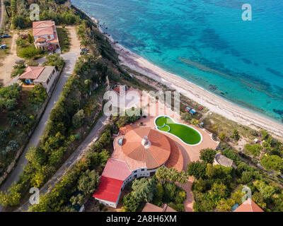 Aerial view of the Calabrian coast, villas and resorts on the cliff. Transparent sea and wild coast. Locality of Riaci near Tropea, Calabria. Italy Stock Photo