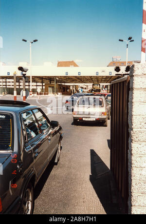 Michael Scott/Alamy Live News - Berlin, Germany April 1990 -  West Germans queue up to visit East Germany through a checkpoint in April 1990. Stock Photo