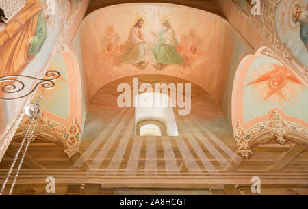 SERGIEV POSAD, MOSCOW REGION, RUSSIA - MAY 10, 2018: Trinity Lavra of St. Sergius, interior of Church of Descent of the Holy Spirit. Fresco over windo Stock Photo