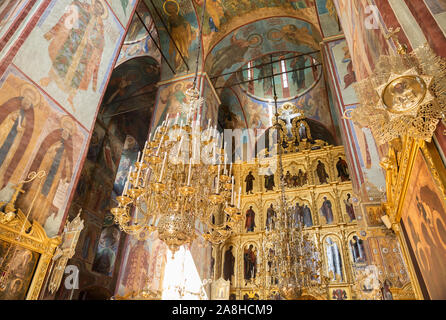 SERGIEV POSAD, MOSCOW REGION, RUSSIA - MAY 10, 2018: Trinity Lavra of St. Sergius, interior of Assumption Cathedral. Walls with frescoes depicting sai Stock Photo
