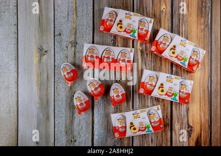 New York NY NOV 08 2019: Kinder Surprise Egg between many chocolate egg is a sweet present by Italian confectionery manufacturer Ferrero Stock Photo
