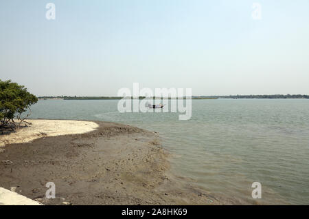 Traditional fishing boat in the delta of the Ganges River in Sundarbans Jungle National Park, India Stock Photo