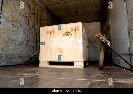 The radioactive material label beside the transportation wooden box Type A standard package in the truck Stock Photo