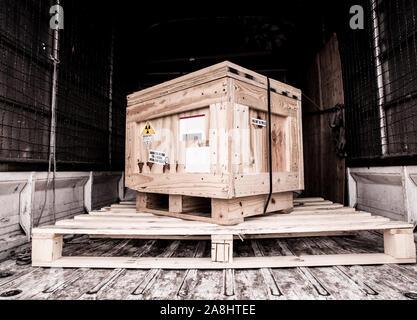 The radioactive material label beside the transportation wooden box Type A standard package in the truck Stock Photo