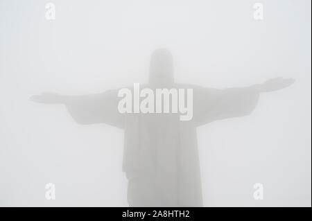 Rio de Janeiro, Brazil - September 14, 2019.  Redeemer Christ statue on Corcovado hill covered with fog. Stock Photo