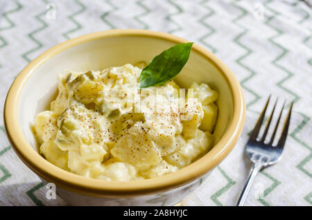 Fresh homemade potato salad.  Classic American potato salad made with creamy mayonnaise dressing. Stock Photo