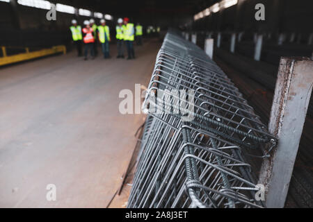 Shallow depth of field (selective focus) image with steel designed for reinforced concrete, in a factory. Stock Photo