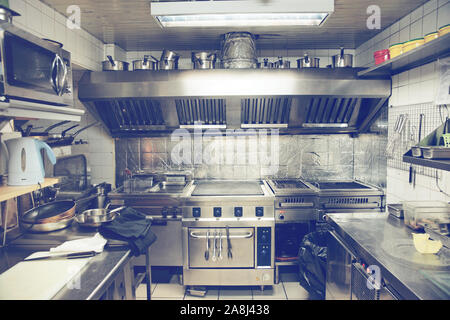 Typical kitchen of a restaurant shot in operation, toned image Stock Photo