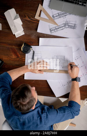 Mature men with blueprint on construction site Stock Photo - Alamy
