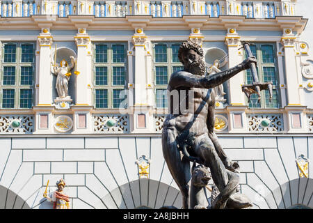 Neptune fountain with Arthur Court in background in Gdansk, Poland Stock Photo