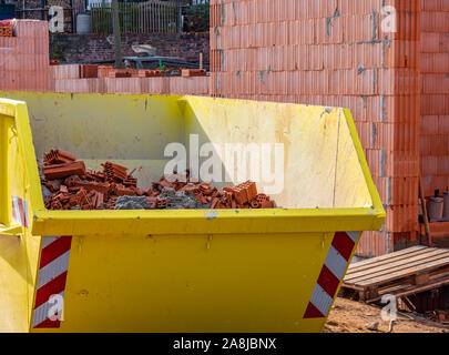 Construction container with rubble from the shell Stock Photo