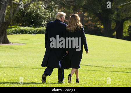 Washington, District of Columbia, USA. 9th Nov, 2019. US President Donald J. Trump (L) and First Lady Melania Trump (R) walk aross the South Lawn of the White House to depart by Marine One in Washington, DC, USA, 09 November 2019. The President and First Lady will attend a National Collegiate Athletic Association (NCAA) football game between Alabama and Louisiana State University in Tuscaloosa, Alabama; then they will stay in New York City through Veterans Day Credit: Michael Reynolds/CNP/ZUMA Wire/Alamy Live News Stock Photo