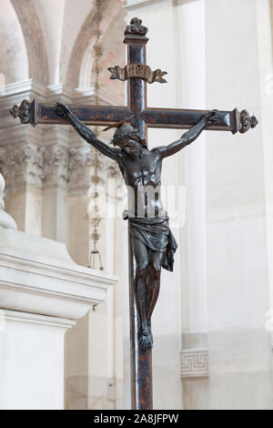 Statue of Jesus Christ on a cross inside a church, depicting the crucifixion Stock Photo