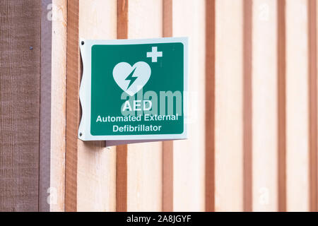 Defibrillator AED sign and symbol on wall Stock Photo