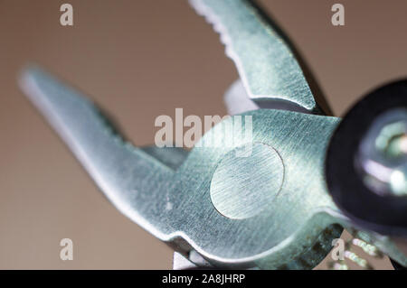 elements small foldable steel multitool, closeup, macro Stock Photo