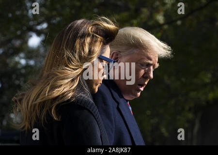 Washington, USA. 9th Nov, 2019. President Donald Trump and first lady Melania Trump walk across the South Lawn of the White House to depart by Marine One in Washington, DC, on Saturday, November 9, 2019. The president and first lady will attend a National Collegiate Athletic Association (NCAA) football game between Alabama and Louisiana State University in Tuscaloosa, Alabama, and then stay in New York City through Veterans Day. Photo by Michael Reynolds/UPI Credit: UPI/Alamy Live News Stock Photo