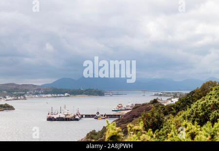 Skye island,Kyleakin/Scotland, UK-23AUG2019. The Skye bridge is connecting isle of Skye and mainland. Seen from viewpoint, island mountains in the dis Stock Photo