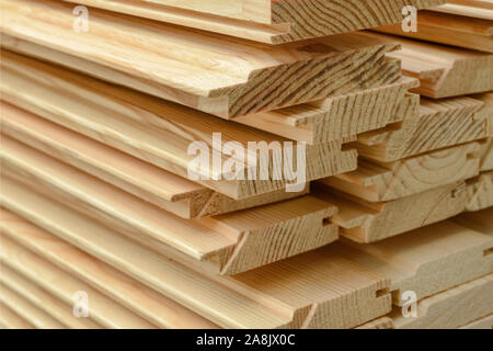 End view of stacked lining board. Wooden structure closeup. Stock Photo
