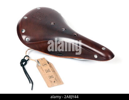 A leather bicycle saddle photographed on a white background Stock Photo