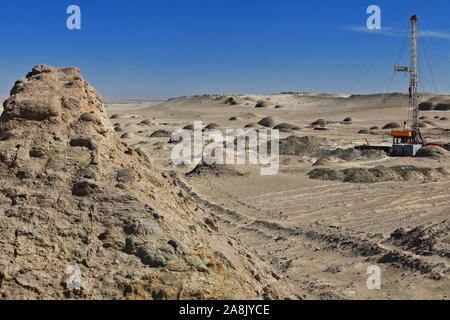 Oil well among rounded yardangs-wind eroded rock surfaces. Qaidam desert-Qinghai-China-0565 Stock Photo