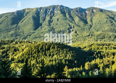 Looking across the I90 corridor from Exit 38 towards Mailbox Peak in the central Cascade mountains of Washington State, USA. Stock Photo