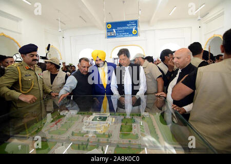 (191109) -- NAROWAL (PAKISTAN), Nov. 9, 2019 (Xinhua) -- Photo released by Pakistan's Press Information Department (PID) shows Pakistani Prime Minister Imran Khan briefed by authorities about the Kartarpur Corridor in Narowal district of Pakistan's Punjab province, on Nov. 9, 2019. Pakistani Prime Minister Imran Khan on Saturday inaugurated the Kartarpur Corridor to allow Indian Sikh pilgrims to visit a holy shrine in Narowal district. (PID/Handout via Xinhua) Stock Photo