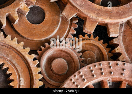 Grunge gears and wheels create an industrial steampunk background. Machine parts, and mechanical machinery make for a nice grunge look. Stock Photo