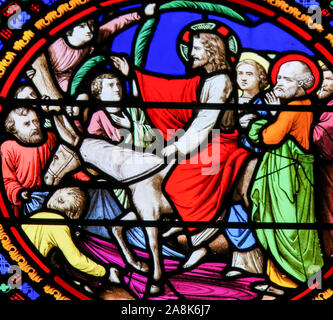 Stained Glass in the Chapel of Notre-Dame-des-flots (1857) in Sainte Adresse, Le Havre, France, depicting Jesus entering Jerusalem on Palm Sunay Stock Photo