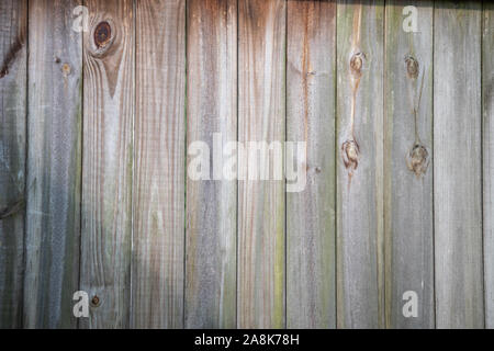 A wall of wooden boards is a nice background, texture or wallpaper. A good place for a message or announcement. Bokeh effect. Stock Photo