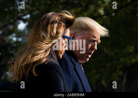Washington DC, USA. 09th Nov, 2019. US President Donald J. Trump (R) and First Lady Melania Trump (L) walk aross the South Lawn of the White House to depart by Marine One in Washington, DC, USA, 09 November 2019. The President and First Lady will attend a National Collegiate Athletic Association (NCAA) football game between Alabama and Louisiana State University in Tuscaloosa, Alabama; then they will stay in New York City through Veterans Day. Credit: MediaPunch Inc/Alamy Live News Stock Photo