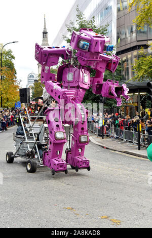 A robot made from wheelie bins during The Lord Mayor's Show in London.The traditional yearly procession brings together over 6,500 people, 120 horses and over 60 decorated floats in a major spectacle that dates back to the 13th century. It's 3 miles long and travels from Mansion House to the Royal Courts of Justice where the Lord Mayor takes an oath of allegiance to the sovereign before the Lord Chief Justice. Stock Photo