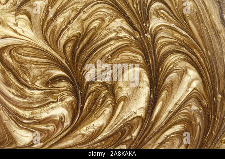 Painted background. Abstract emotional art. Golden liquid acrylic paints Stock Photo