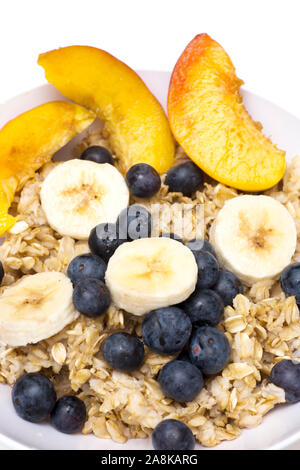 Dish Of Hot Oatmeal With Blueberries And Bananas, Isolated On White 