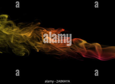 multicolored smoke on a black background Stock Photo