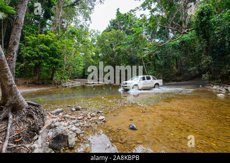 Toyota Hilux car crossing Emmagen Creek on the Bloomfield Track, Cape Tribulation, Far North Queensland, QLD, FNQ, Australia Stock Photo